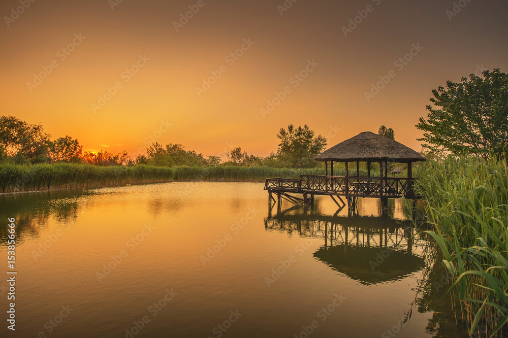 Fototapeta premium A beautiful lake and a gazebo on it