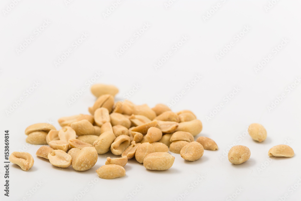 Fried salted peanuts on white background. snack. Fried salted peanuts on white background. snack.
