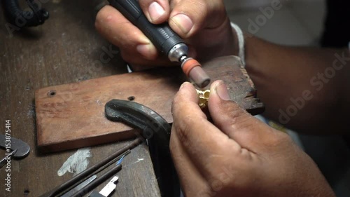 Slow motion video,Goldsmith is polishing a gold or silver ring