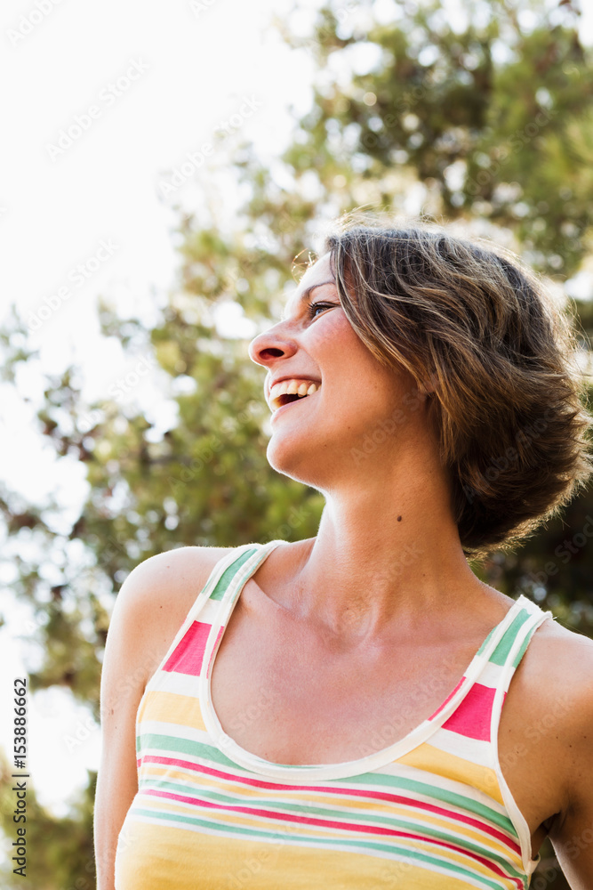 Smiling woman standing outdoors Smiling woman standing outdoors