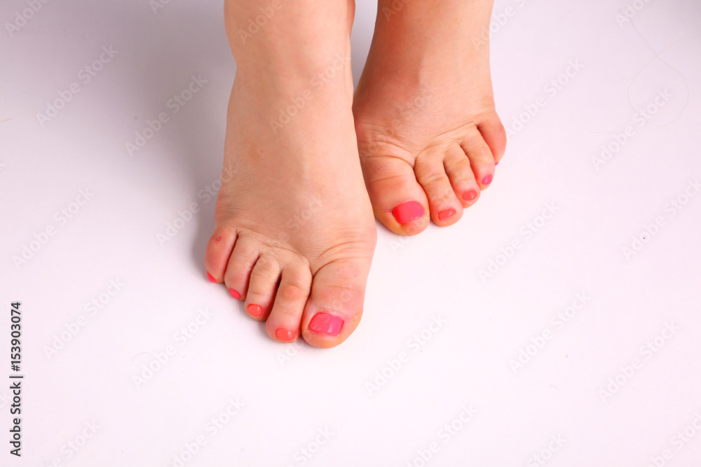 Closeup photo of a beautiful female feet with pedicure Closeup photo of a beautiful female feet with pedicure