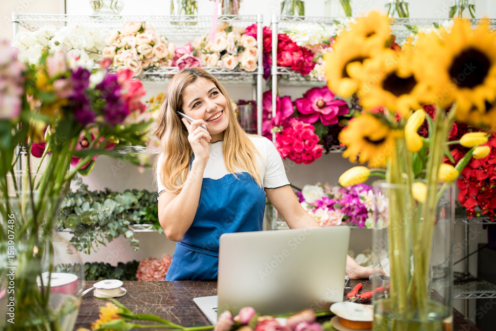 Female florist talking on the phone