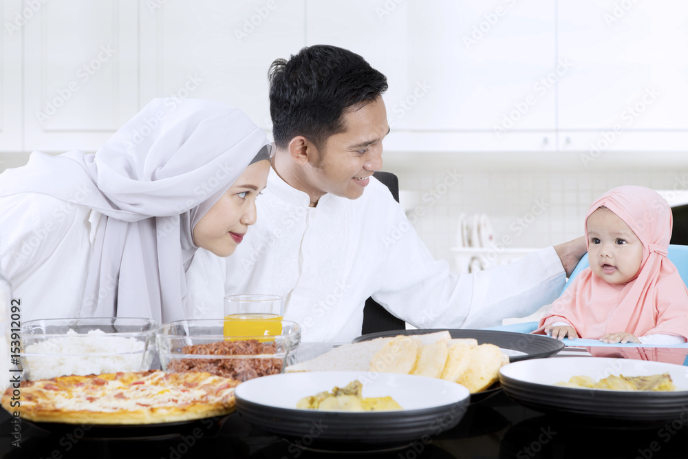 Muslim family having meal together Muslim family having meal together