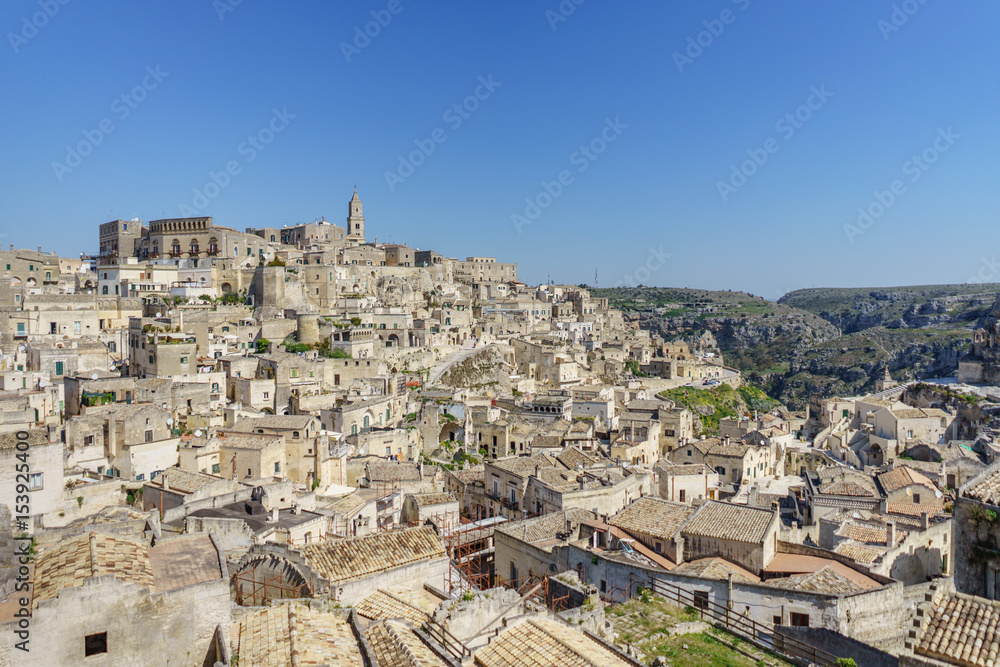 beautiful horizon of ancient ghost town of Matera (Sassi di Matera) in beautiful bright sun shine with blue sky, south Italy