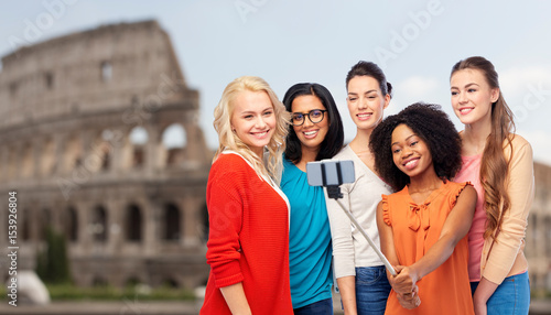 international women taking selfie over coliseum