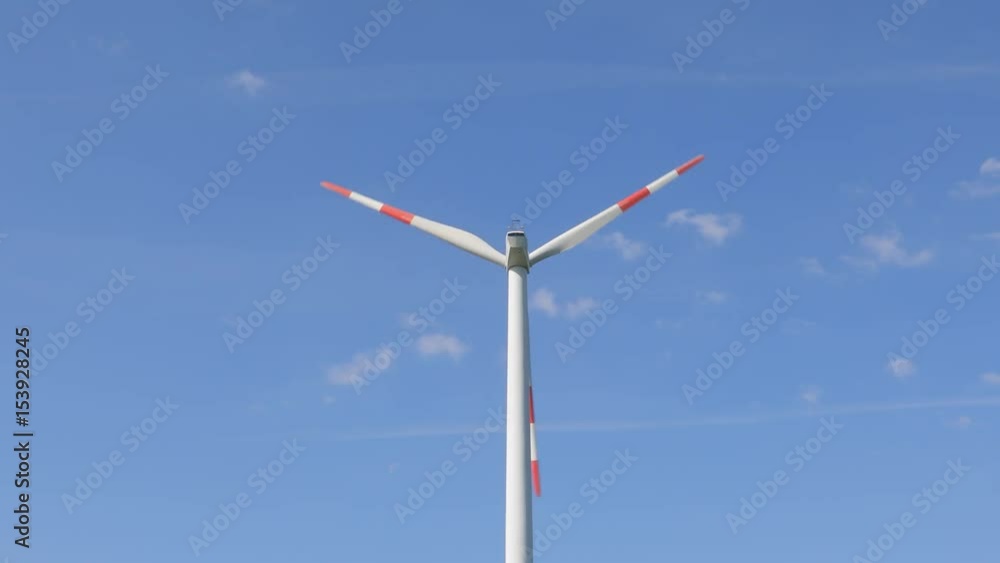 Wind tubines against blue sky