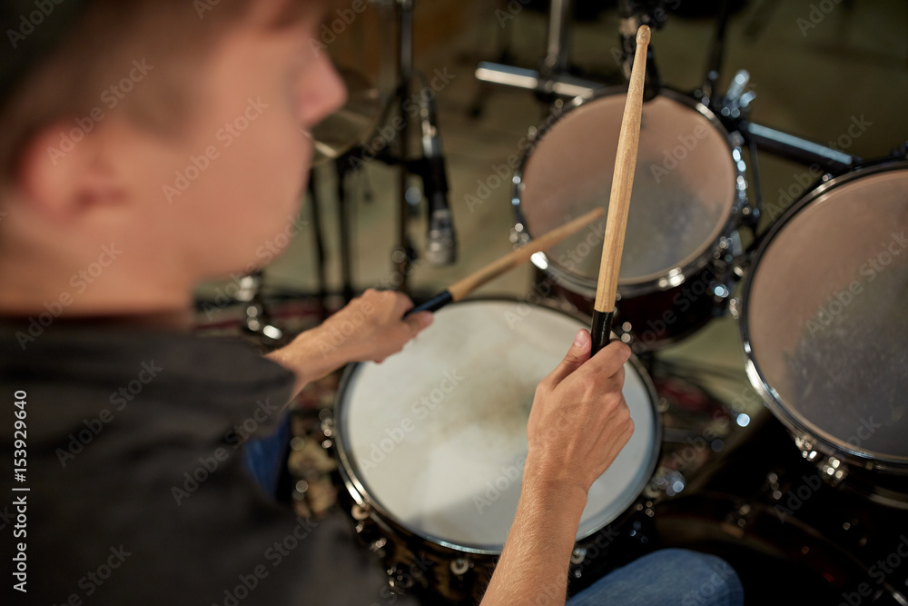 man playing drums at concert or music studio man playing drums at concert or music studio
