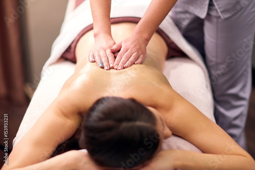 woman having back massage with gel at spa