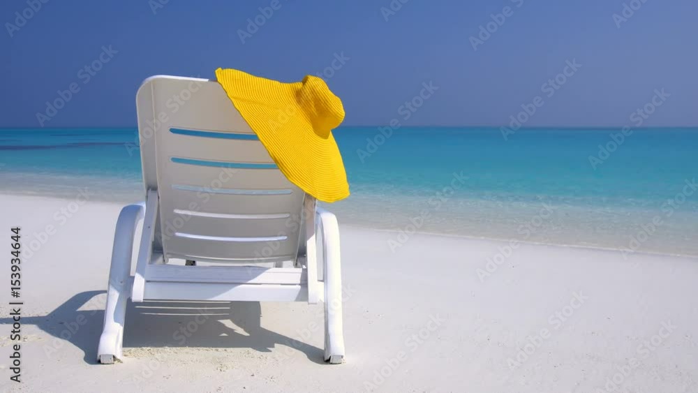 Straw yellow sunhat on chair longue at perfect wild sandy beach with turquoise sea view, nobody, travel destinations concept
Straw yellow sunhat on chair longue at perfect wild sandy beach with turquoise sea view, nobody, travel destinations concept