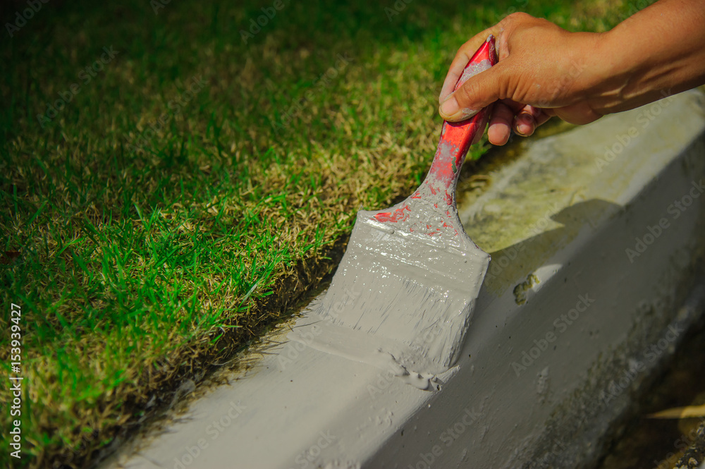 Naklejka premium construction worker painting curb
