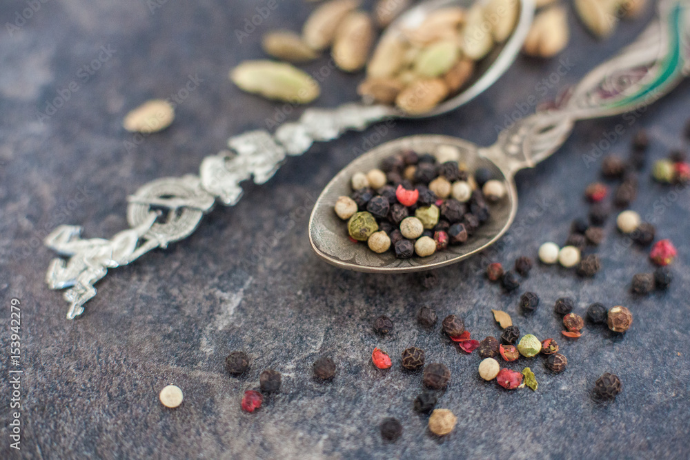 Composition with different spices and mortar on dark wooden background Composition with different spices and mortar on dark wooden background