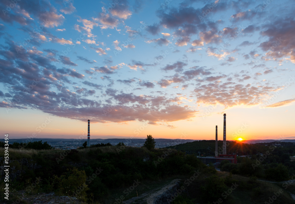 Sunset above the chimney, chemical industry