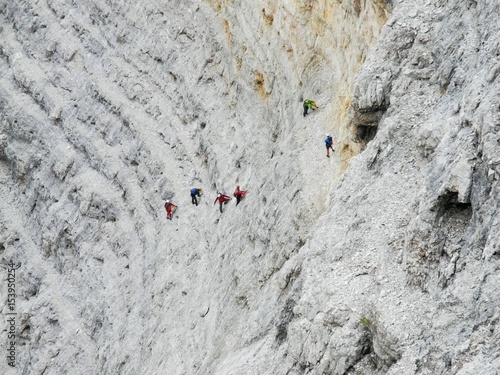 Kletterer in der Ferrata Giovanni Lipella in der Westwand der Tofana die Rozes, Dolomiten, Südtirol, Italien photo