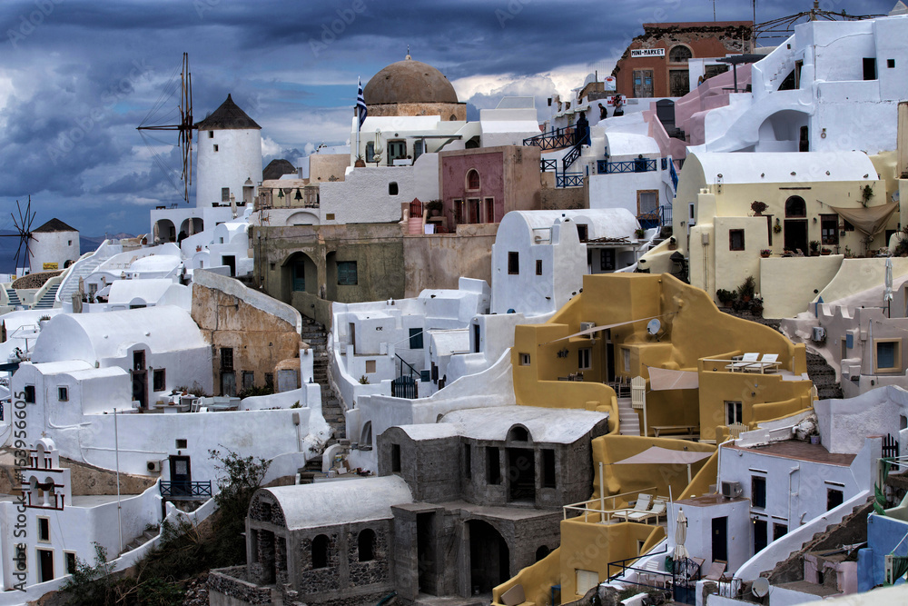 Typical architecture of village Oia, Santorini. Houses are traditional painted in pastell colors
