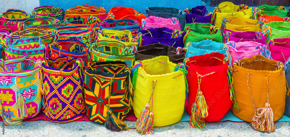 Fototapeta premium Street vendor selling craft bags in Cartagena, Colombia