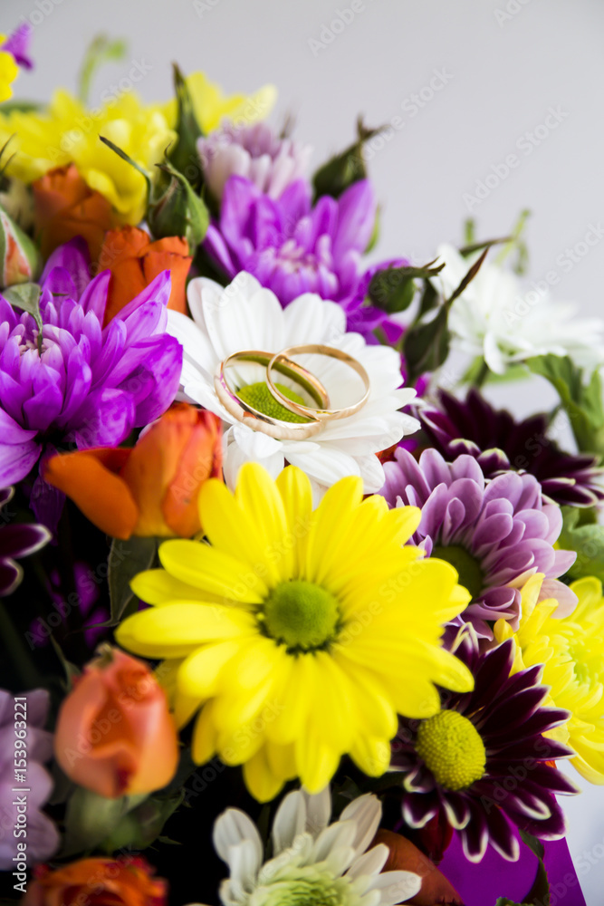 Wedding rings on a bright spring bouquet of the bride Wedding rings on a bright spring bouquet of the bride
