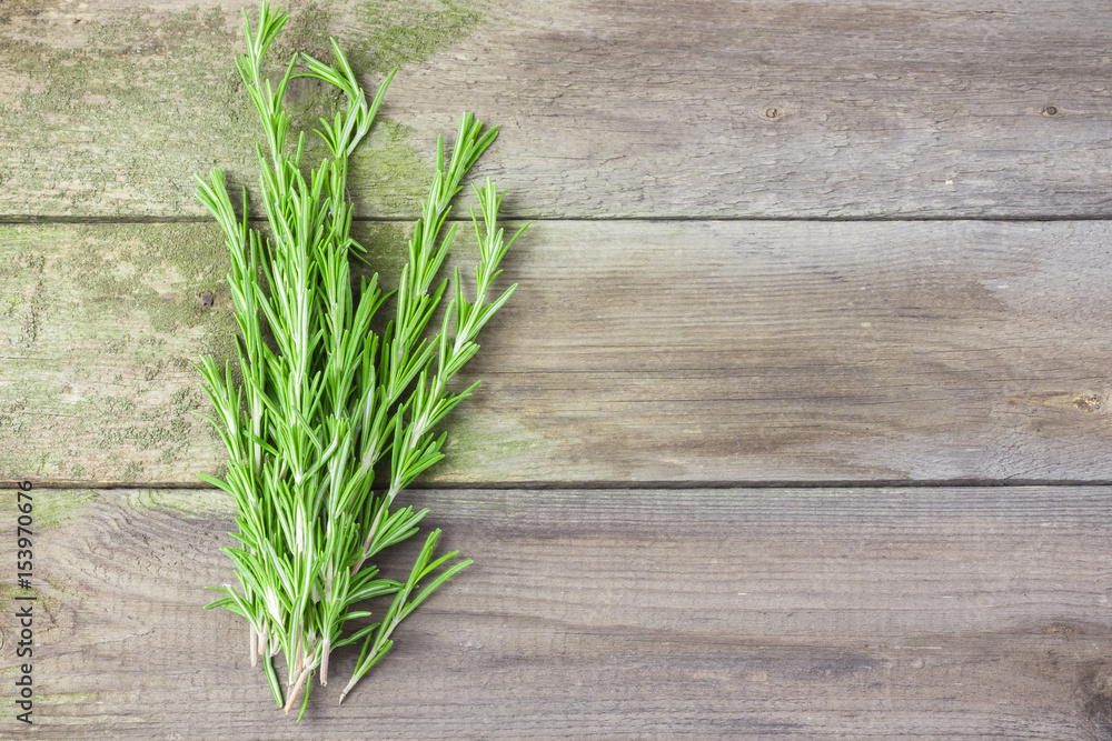 Fresh rosemary on wooden board. Fresh rosemary on wooden board.