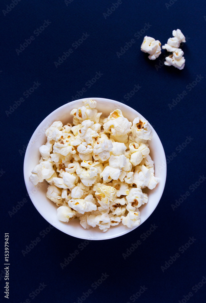 Salty movie theater popcorn in a bowl ready-to-eat Salty movie theater popcorn in a bowl ready-to-eat