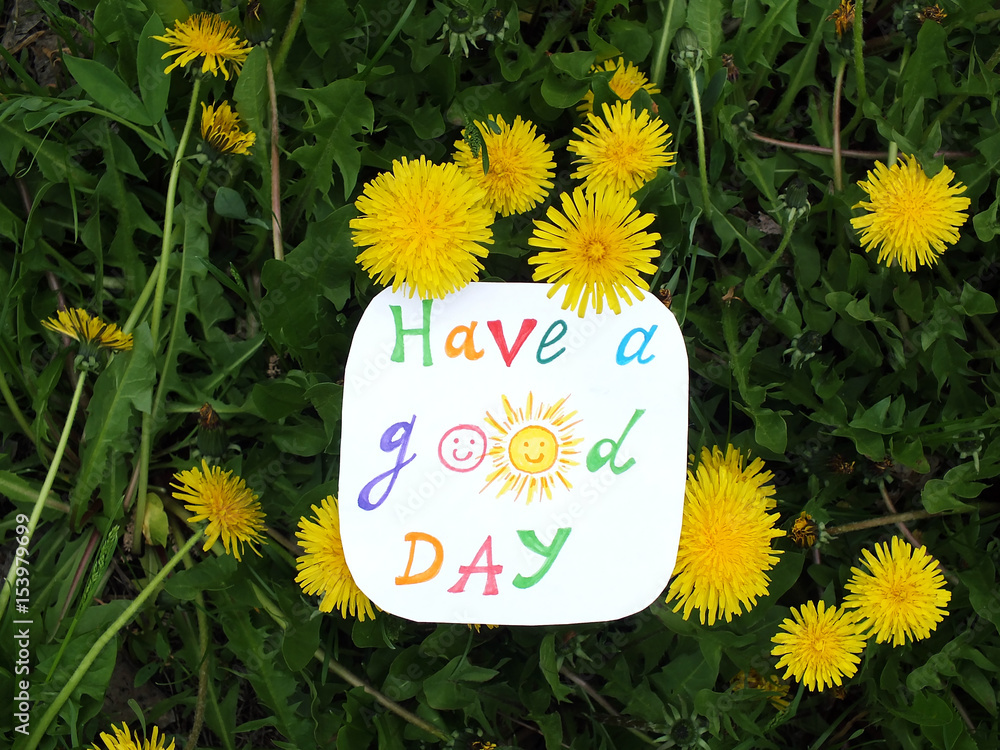 Naklejka premium Paper note with phrase: Have a good day. Positive attitude concept