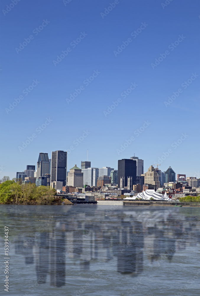 View of Montreal city with reflection on the water, day