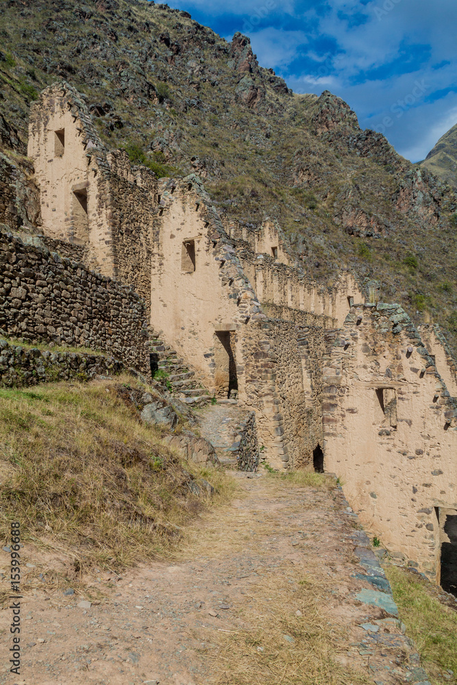 Fototapeta premium Ruins of Pinkulluna (Inca storehouses) above village Ollantaytambo, Sacred Valley of Incas, Peru
