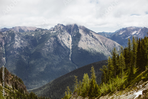 Mountain in North Cascades with waterfall and forests