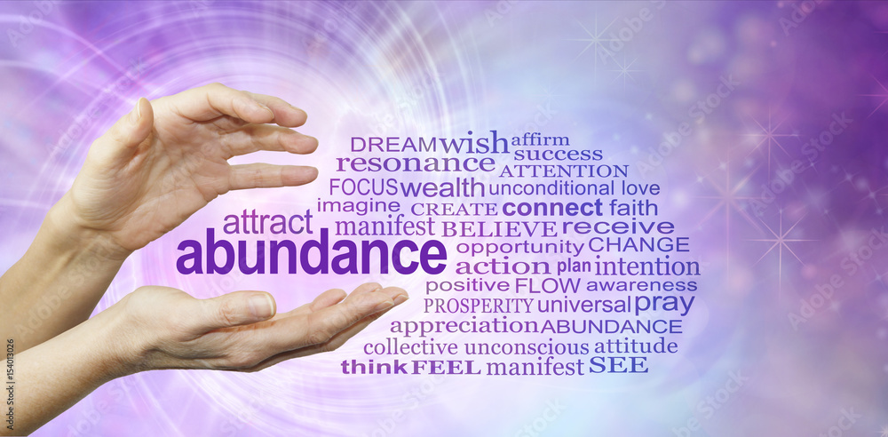 Fototapeta Attract Abundance Word Cloud - female hands with the word ABUNDANCE  floating be