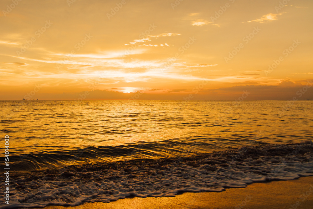 Beautiful golden sunset on sea shore. Landscape ocean waves at sunset