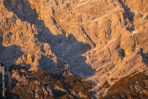 Human silhouette on dolomitic face at sunset, Dolomites