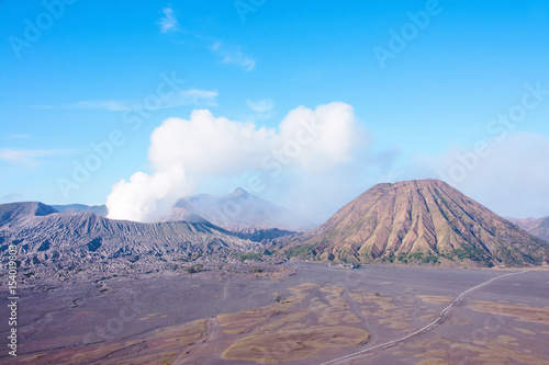 Mount Bromo, an active volcano with clear blue sky at the Tengger Semeru National Park in East Java, Indonesia.