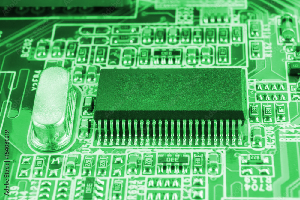 Chip on motherboard mainboard with controllers, ports and wires, close-up macro toned Chip on motherboard mainboard with controllers, ports and wires, close-up macro toned