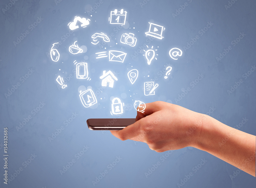 Hand holding tablet phone with drawn icons Hand holding tablet phone with drawn icons