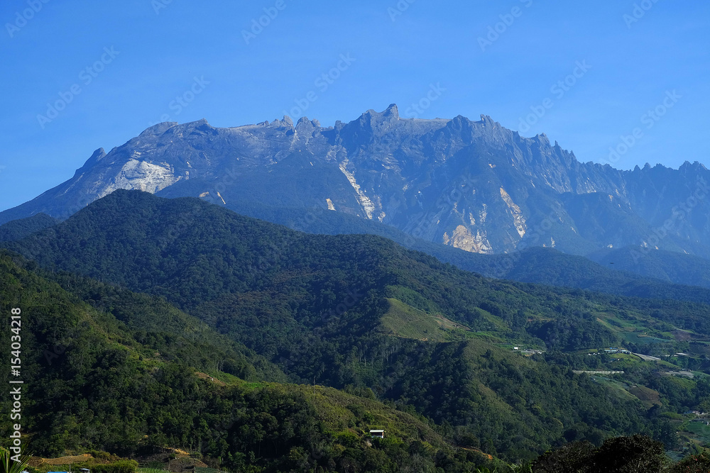 Morning view with Mount Kinabalu blue sky background. 