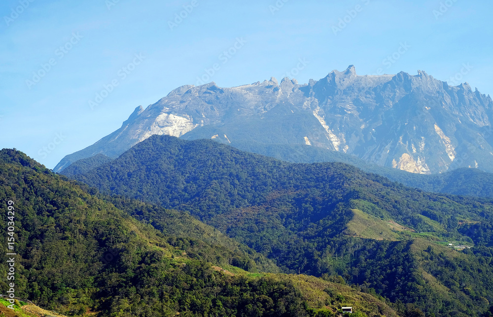 Morning view with Mount Kinabalu blue sky background. 