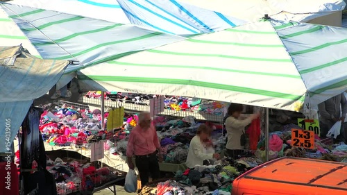 timelapse of women shopping among market stalls