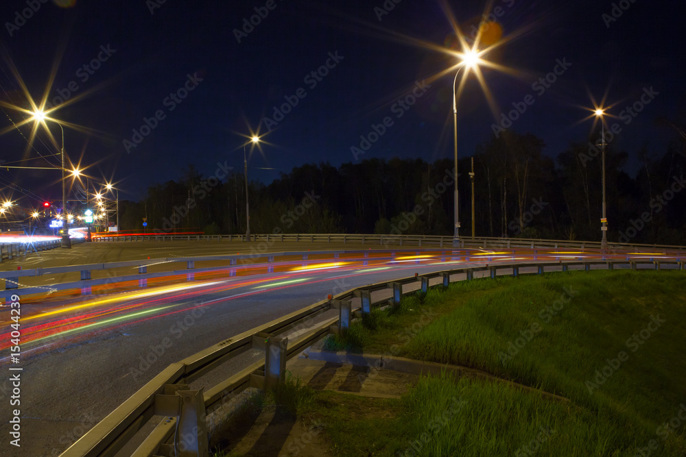 Urban city road with car light trails at night Urban city road with car light trails at night