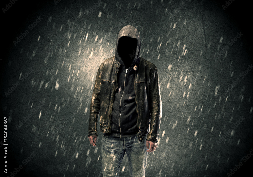 Unknown suspect standing in the dark Unknown suspect standing in the dark