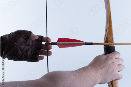 Fényképezés Two arms archer wearing open fingers leather gloves drawing a traditional englis