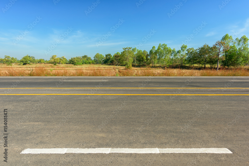 Asphalt road and countryside views Asphalt road and countryside views