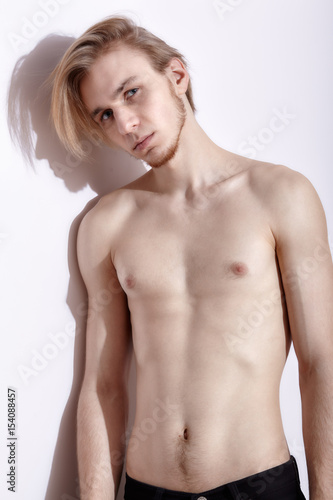 Young blonde man posing