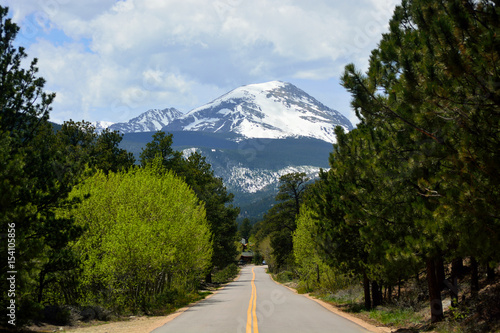 A Straight Road Pointing to Snow Covered Copeland Mountain in Rocky Mountain National Park