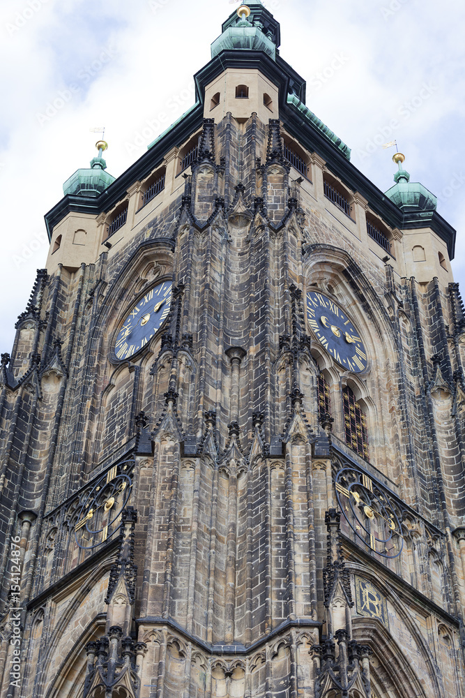 Fototapeta premium 14th century St. Vitus Cathedral , facade, tower with clock, Prague, Czech Republic.