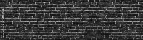 black brick wall, wide panorama as a backdrop