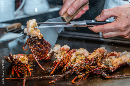 Fotografija Spiny Lobster being cooked at Teppanyaki