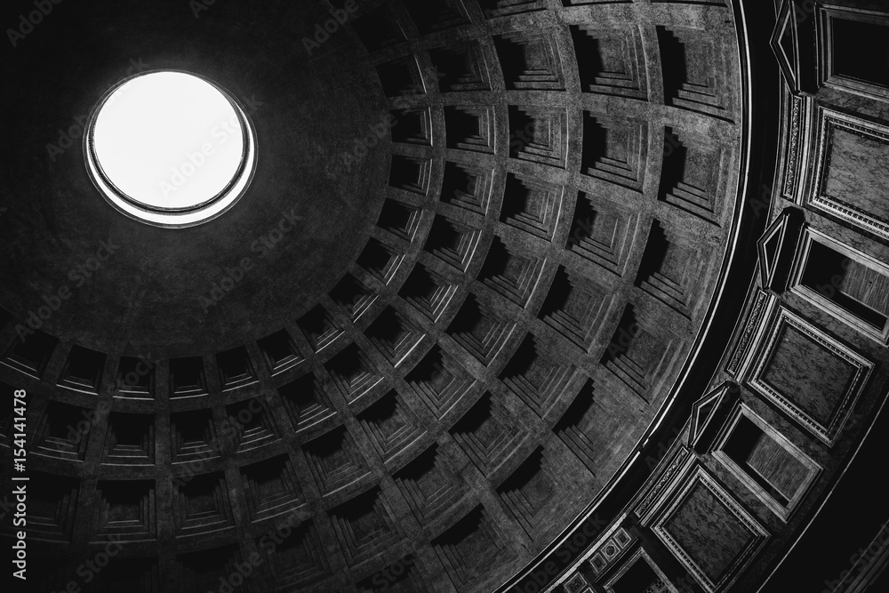 Inside view of the oculus (hole) and dome of the Pantheon in Rome in black and white.