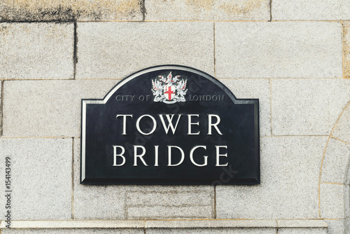 Tower Bridge sign in front of stone