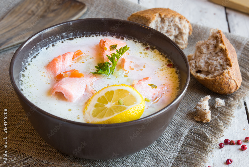 Salmon fish soup with cream in a bowl