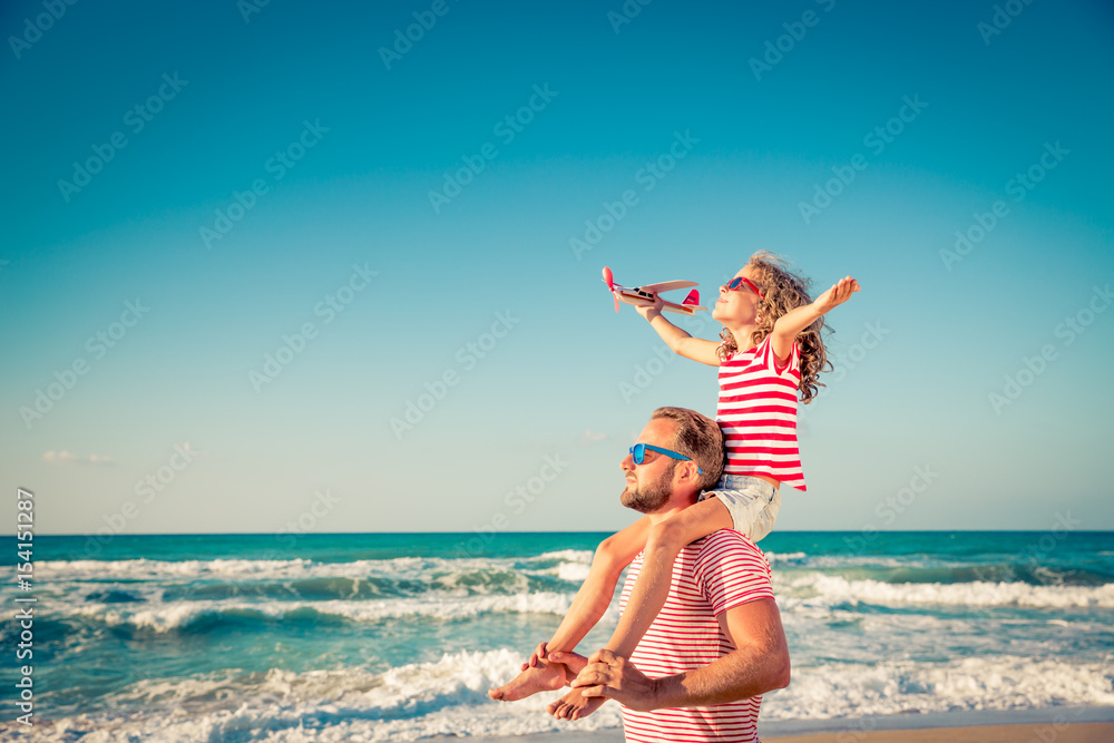 Happy family having fun on summer vacation - obrazy, fototapety, plakaty 