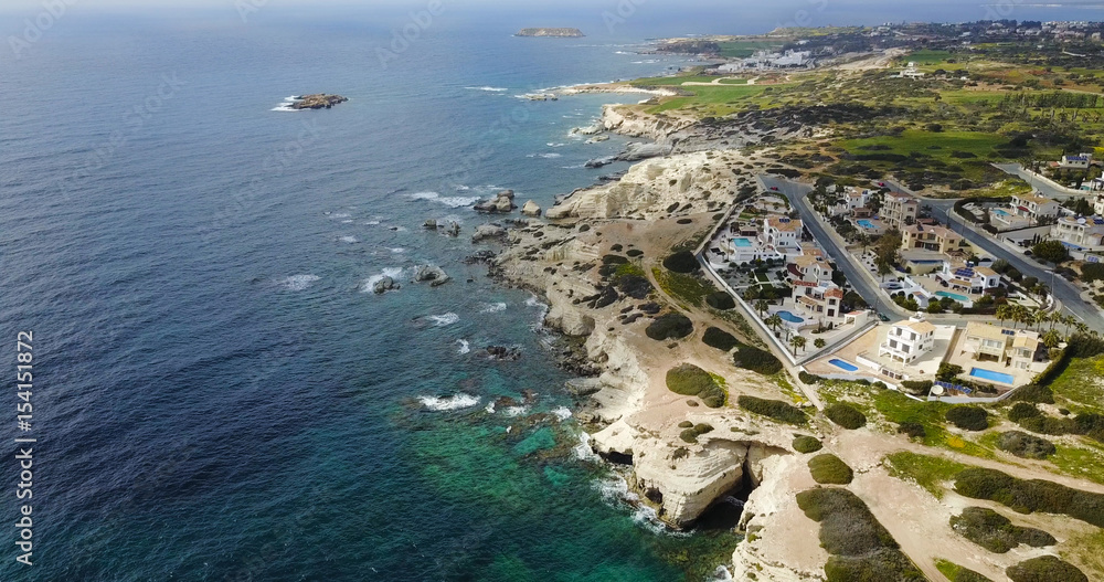 flying over the island. paradise. island with villas and hotels. Mediterranean Sea. Cyprus. Drone Point of View	