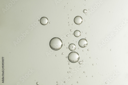 Beautiful shiny air bubbles flows over a gradient background